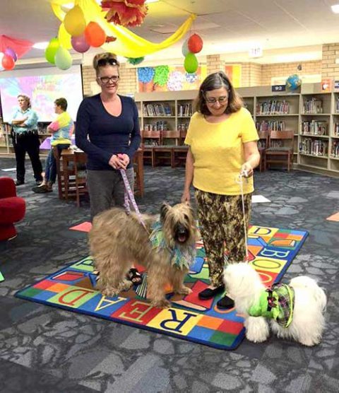 Greater Fort Myers Dog Club volunteers at a children's READ day at the library.
